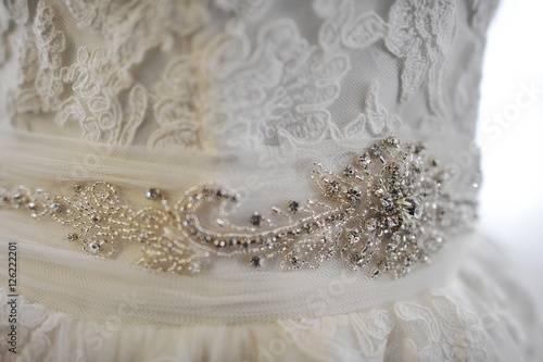 brooch on white wedding dress