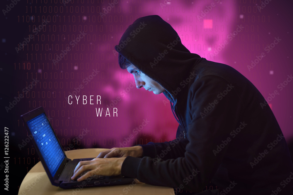 Hacker with laptop initiating cyber attack Hacker with laptop initiating cyber attack