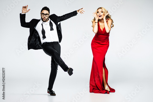 young fashion couple on a white background in studio