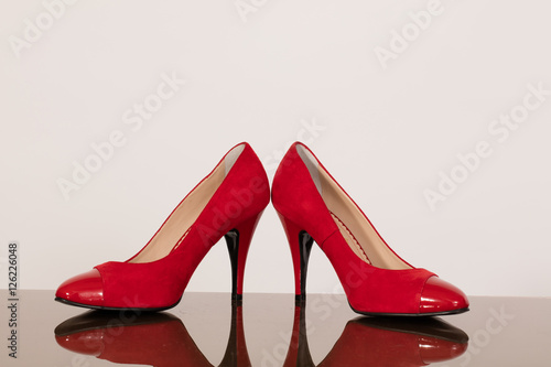 Red high heals shoes on white background