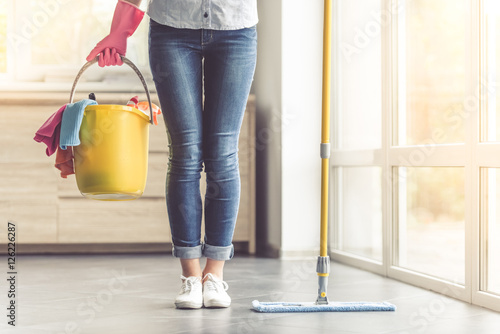 Woman cleaning her house photo