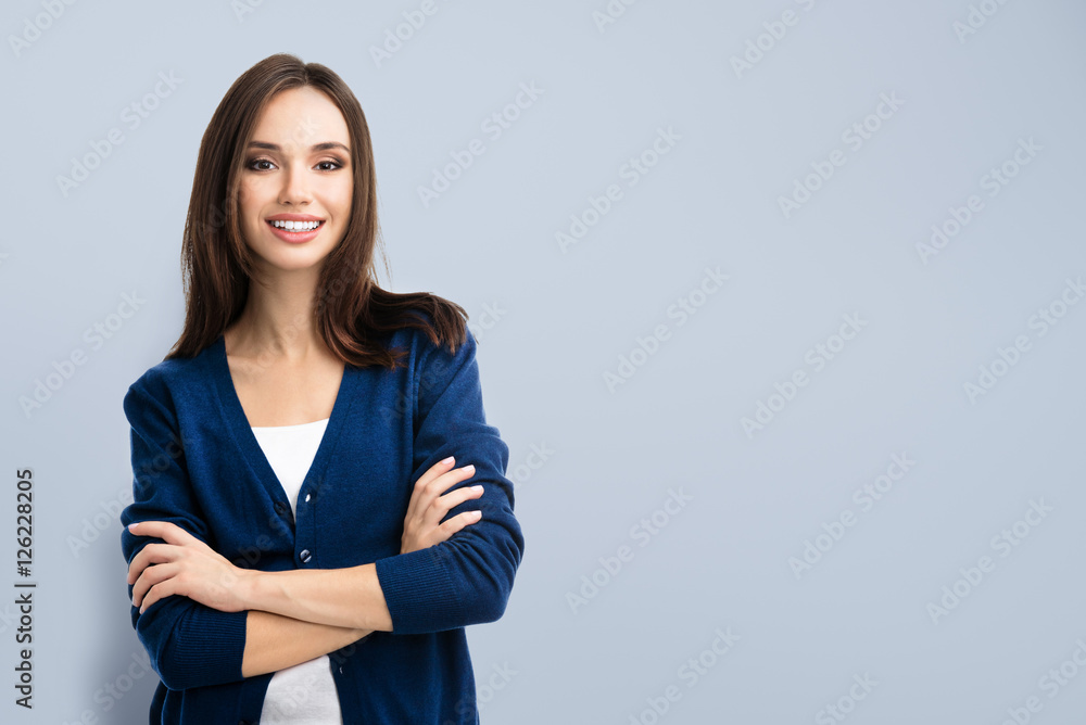 smiling young woman with crossed arms smiling young woman with crossed arms