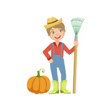Boy Dressed As Farmer With Pumpkin And Rake