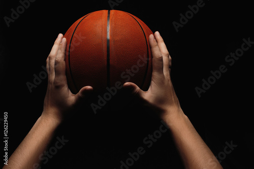 Basketball ball in male hands © master1305