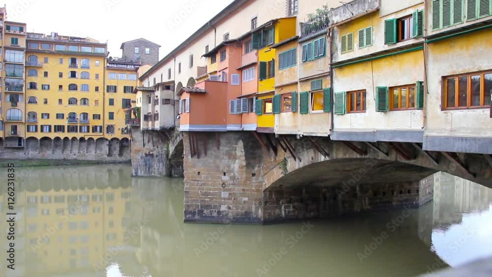 Ponte Vecchio and the Arno river in Florence, Tuscany, Italy Ponte Vecchio and the Arno river in Florence, Tuscany, Italy