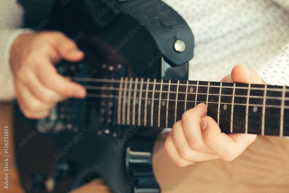 Fototapeta premium man playing electric guitar