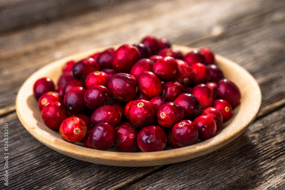 Fresh cranberry on wooden background Fresh cranberry on wooden background