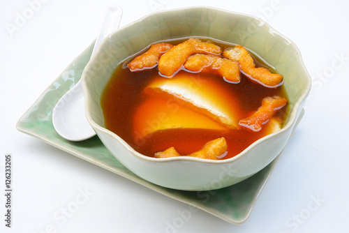 Bean junket eaten hot with gingered syrup, Soy custard
 photo