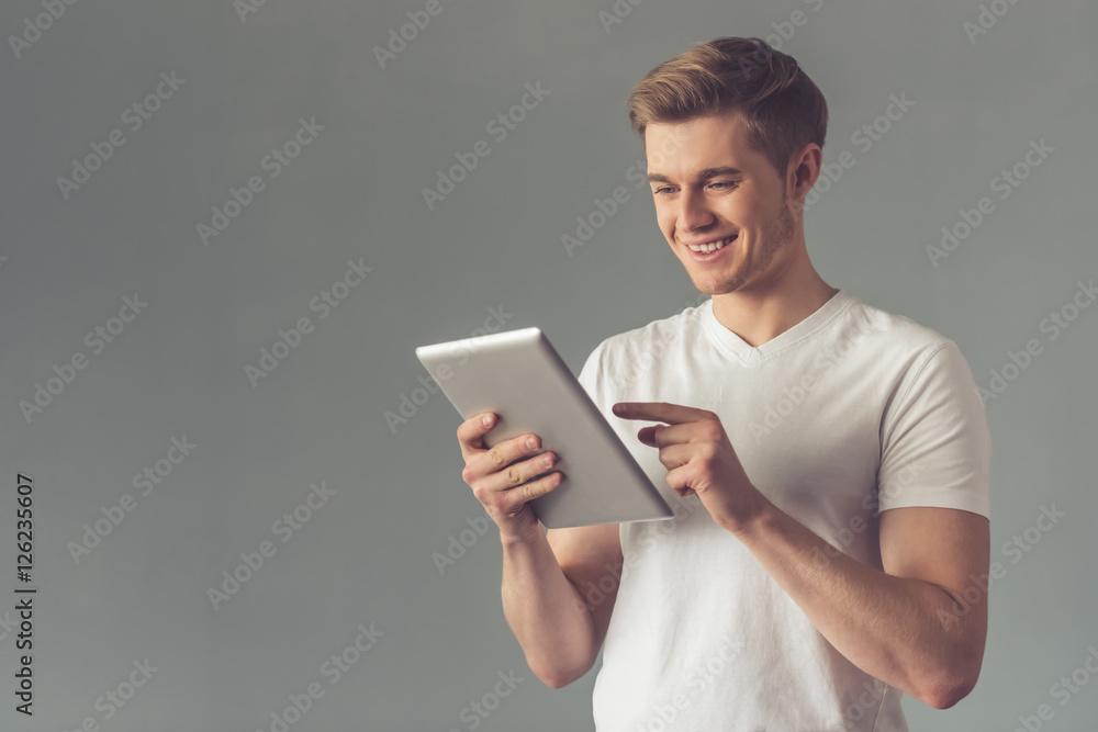 Handsome guy with gadget Handsome guy with gadget