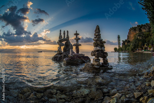 Stone sculptures at sunset by the Ohrid lake