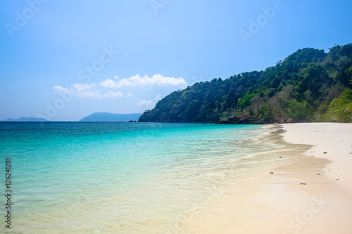 Fototapeta Naklejka Na Ścianę i Meble -  Blue Ocean With Clear Blue Sky and Mountain Behind, Tropical Sea , Thailand