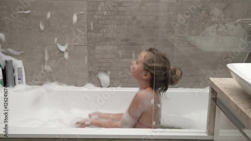Little girl capering in the bathroom