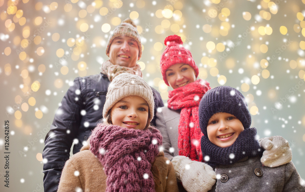 happy family over christmas lights and snow happy family over christmas lights and snow