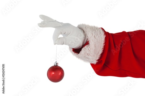 Santa claus holding christmas bauble