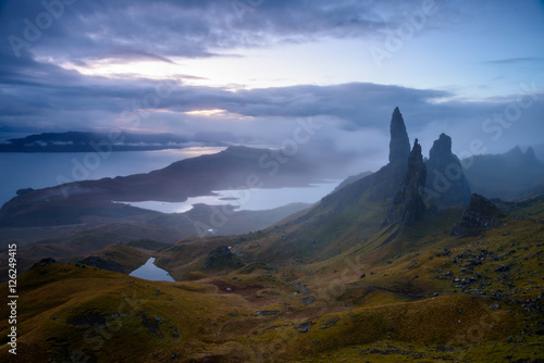 Sunrise at The Old Man of Storr - beautiful panorama of an amazing scenery with vivid colors - symbolic tourist attraction - mystery around the landmark