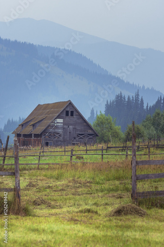 Old wooden barn. Old Romanian wooden shack. Rustic wooden barn