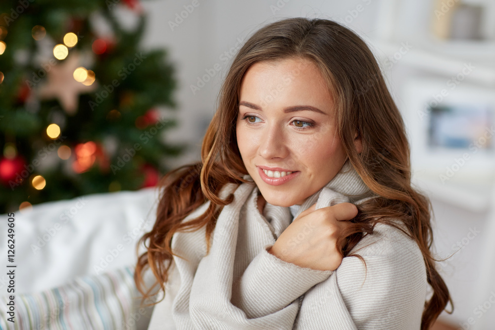 happy young woman with plaid at home for christmas happy young woman with plaid at home for christmas