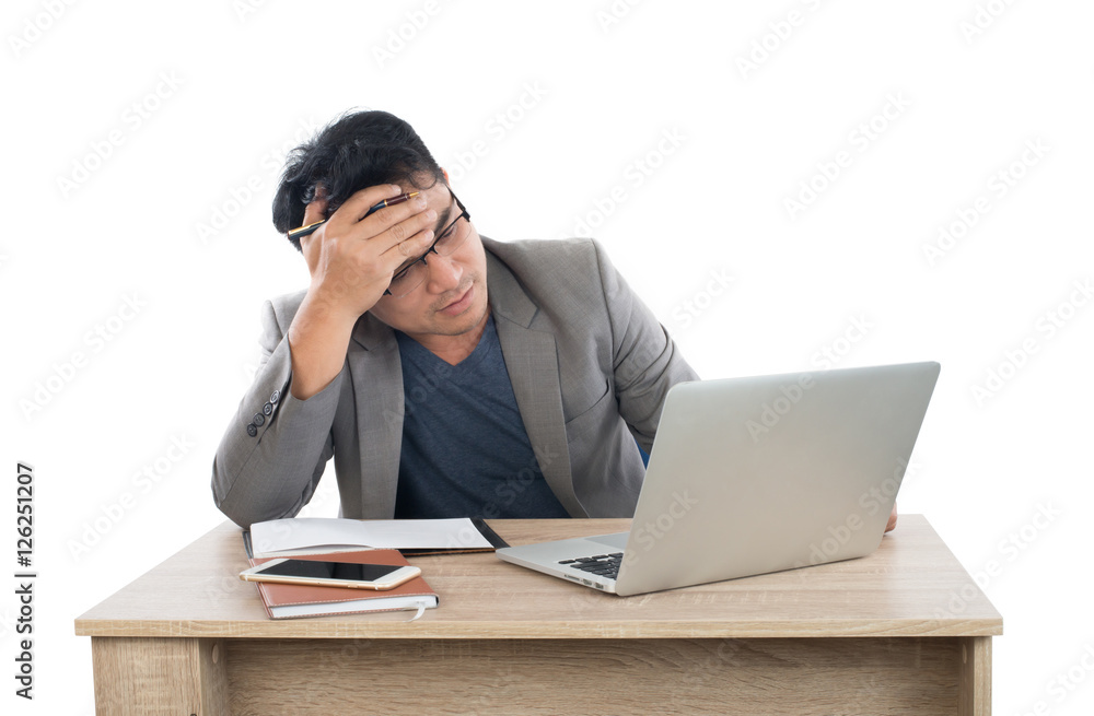 Stressed businessman work with laptop sitting at table isolated Stressed businessman work with laptop sitting at table isolated