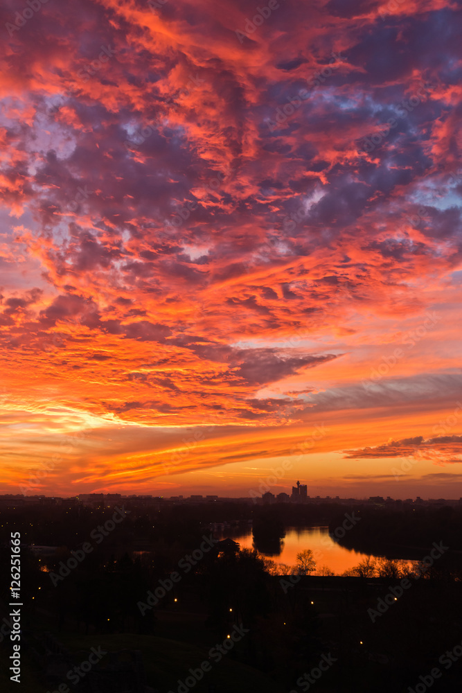 Naklejka premium Dramatic colorful sunset over confluence of Danube and Sava river in Belgrade, Serbia