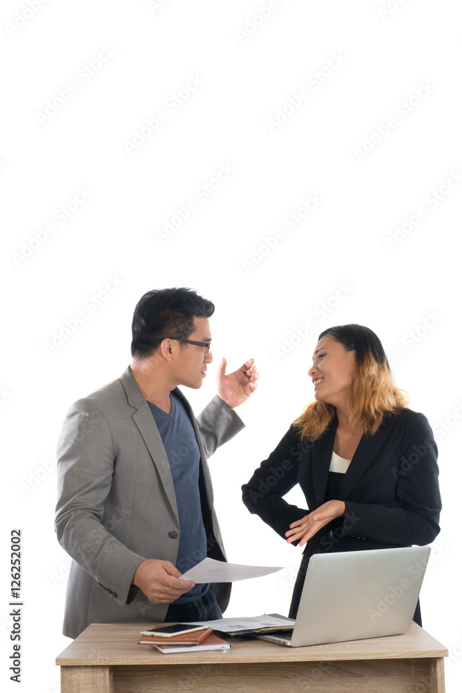 Young business woman standing with her boss conversation about t Young business woman standing with her boss conversation about t
