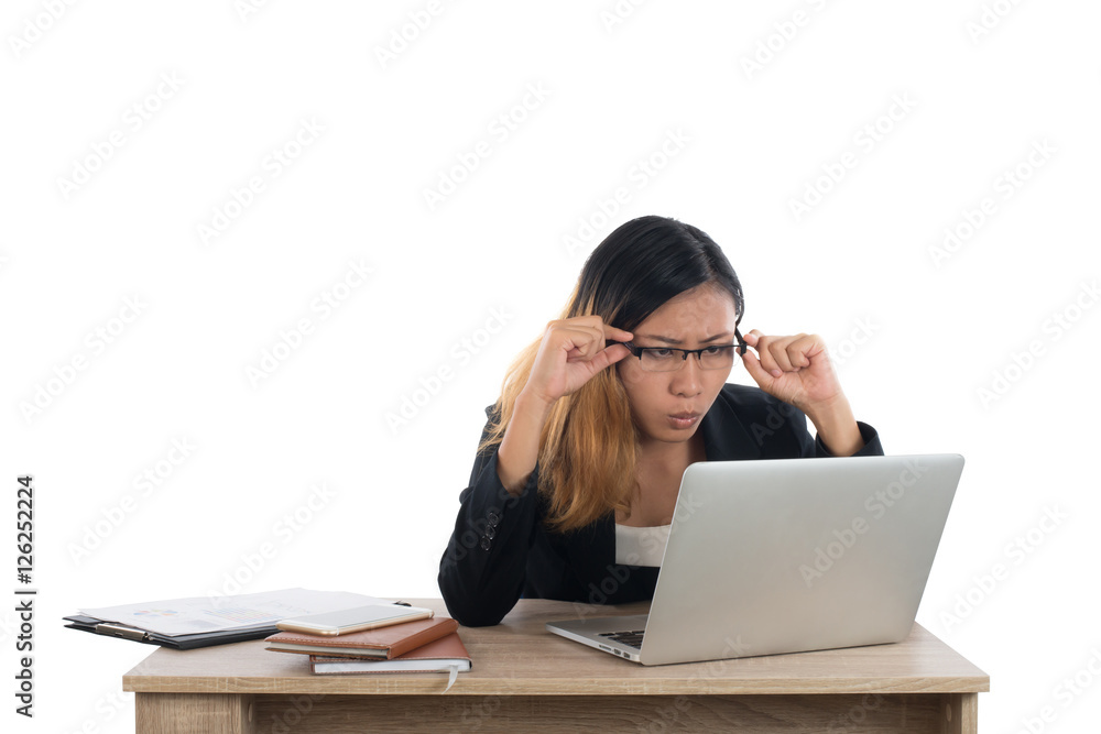 Stressed young business woman at the desk with a laptop isolated Stressed young business woman at the desk with a laptop isolated