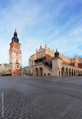 Market square with sukennice historic building and cityhall tower in Krakow at day, Poland