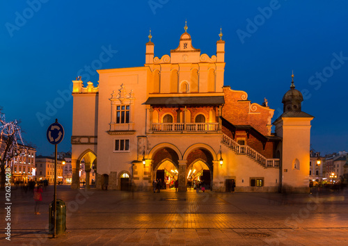 Market square with with sukennice historic building at night in Krakow, Poland © neirfy