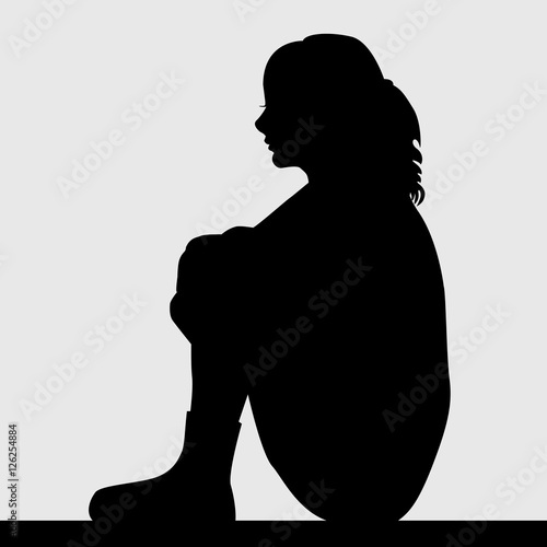 Silhouette of sad woman
