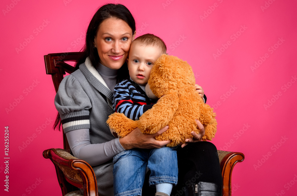 Mother and son sitting in a chair Mother and son sitting in a chair