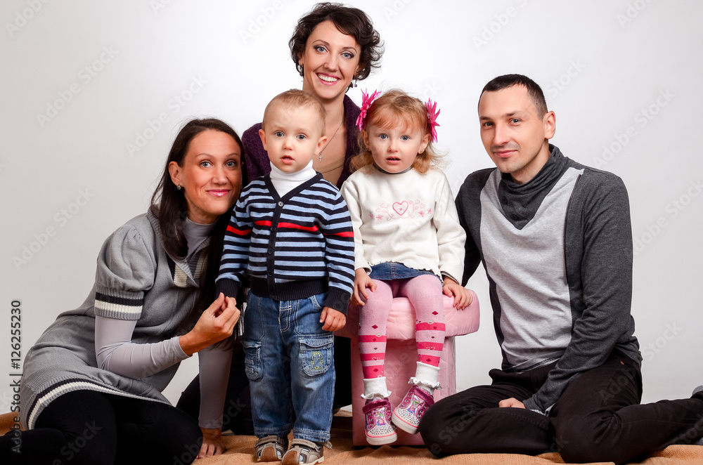 Happy family. Mothers women and kids little girl and boys sittin