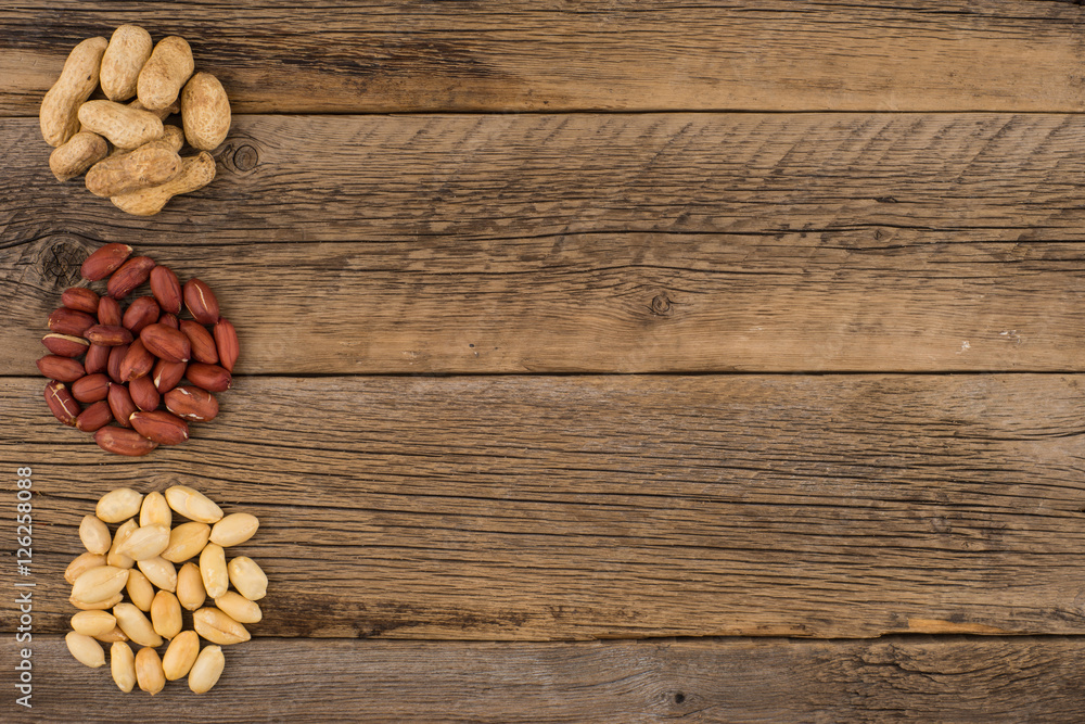 Peanuts on the background of the old wooden table. Peanuts on the background of the old wooden table.