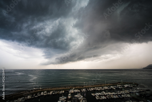 Boats facing storm photo