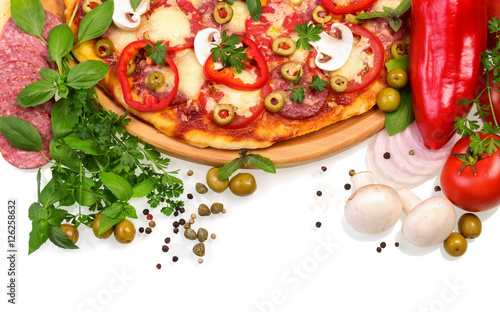 Pizza with mushrooms, sausage and vegetables on white background.
