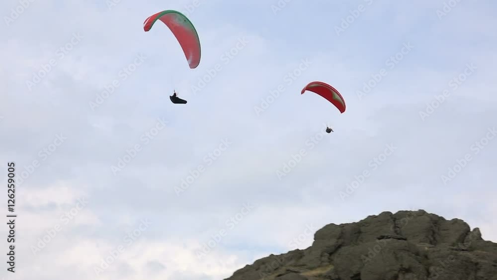 Two Paraglider in Flight Over a Mountain Ridge Summer Day Two Paraglider in Flight Over a Mountain Ridge Summer Day
