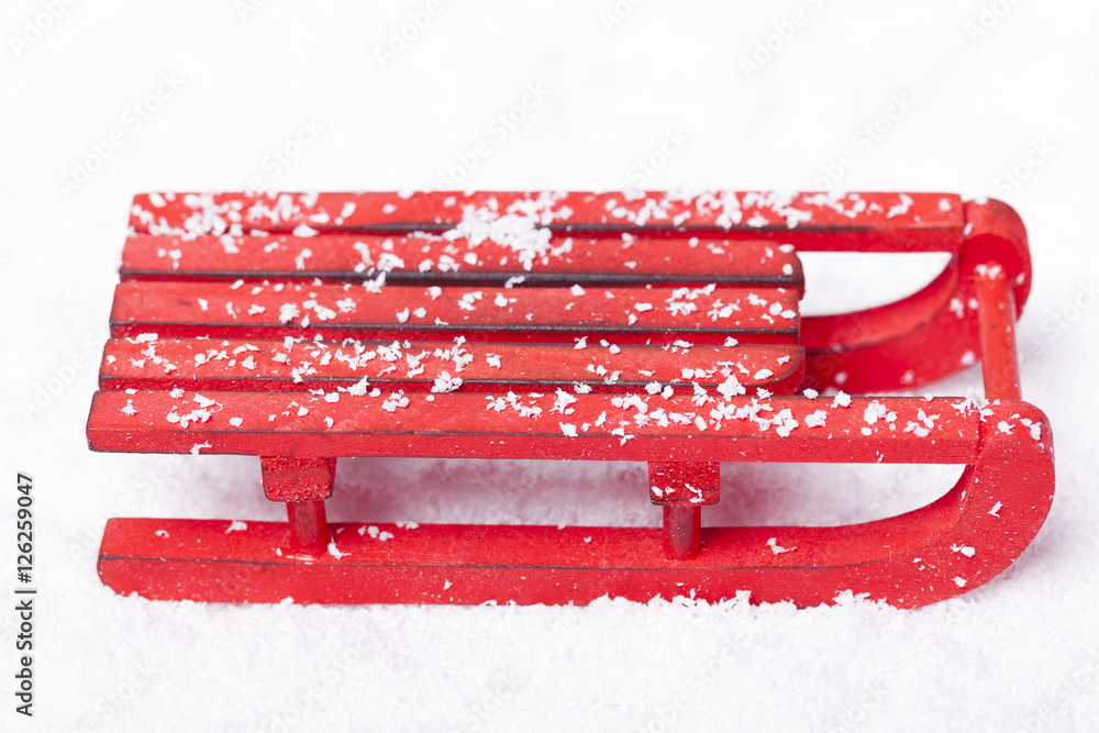 Wooden red sled with snow isolated on white background Stock-foto | Adobe  Stock