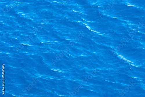 Blue sea surface with waves