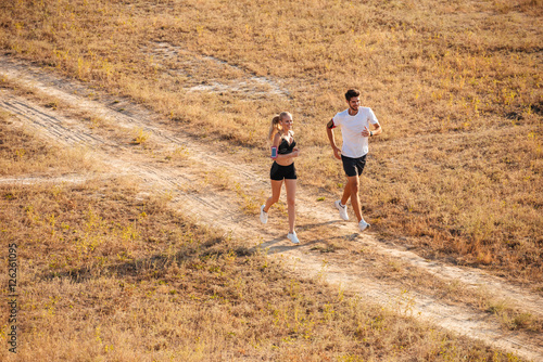 Man and woman joggers exercising outdoors