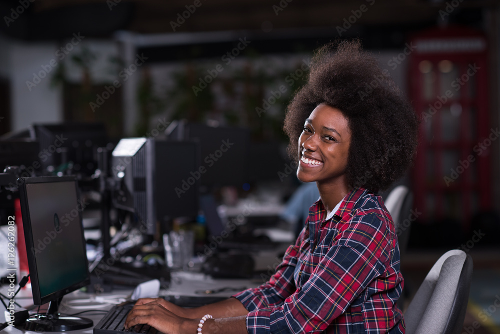portrait of a young African American woman in modern office portrait of a young African American woman in modern office