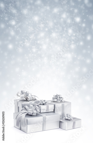 Celebration silver gift boxes on snow background