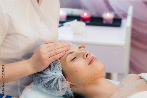 Young  beautiful and healthy woman in spa salon. Traditional oriental massage therapy  beauty treatments.