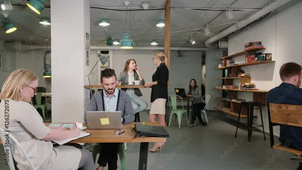 Man working on laptop discovers good news everyone is happy congratulate and applaud him business team in startup office Man working on laptop discovers good news everyone is happy congratulate and applaud him business team in startup office