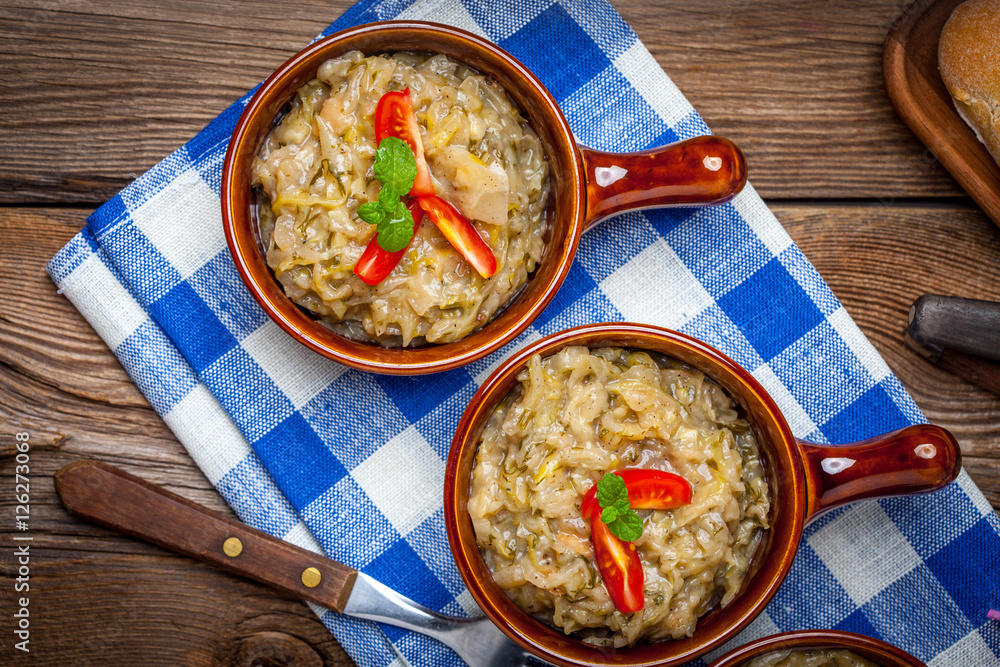 Fried cabbage greens and onion in wooden table. Fried cabbage greens and onion in wooden table.