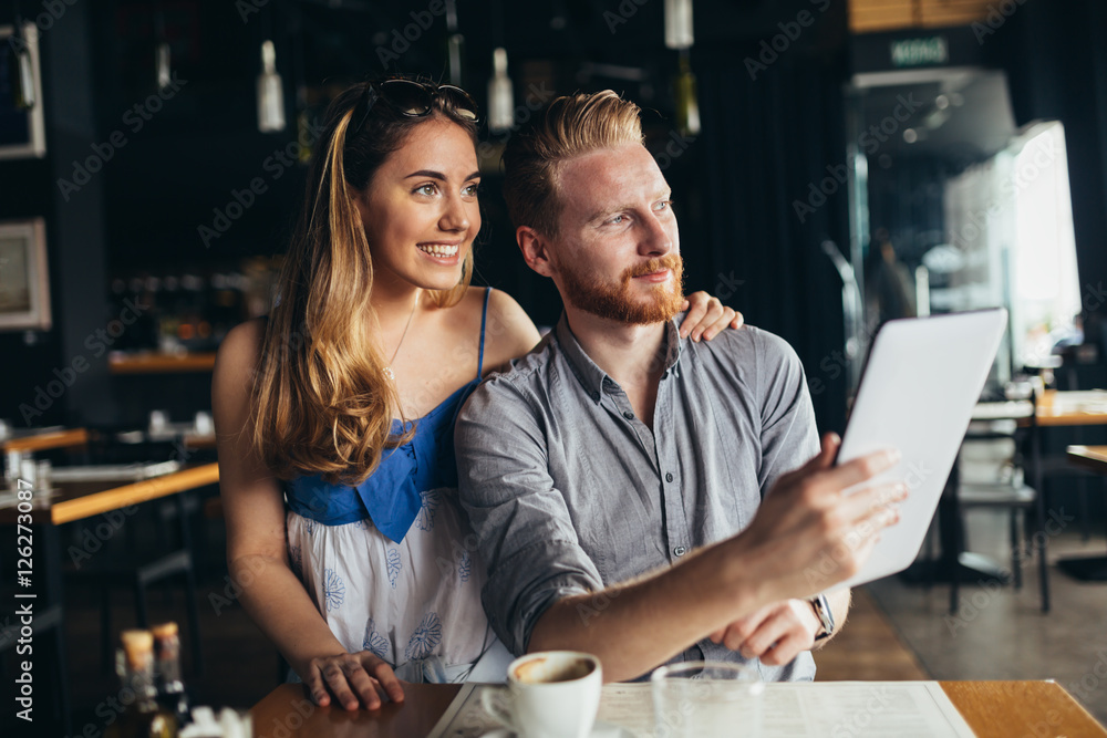 Beautiful couple looking at tablet Beautiful couple looking at tablet
