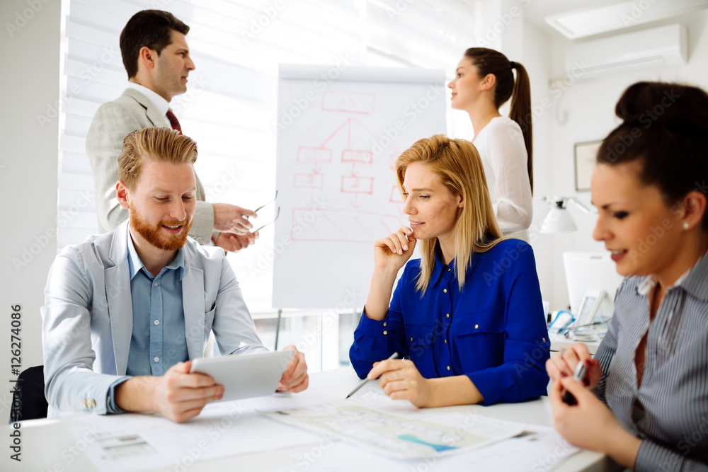 Businesspeople and architects planning Businesspeople and architects planning