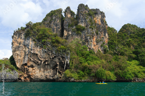 Canoeing and rocks mountain on the andaman sea at Krabi, Thailand. © Tee11
