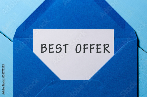 Best offer inscription at letter in blue envelope. Sale concept