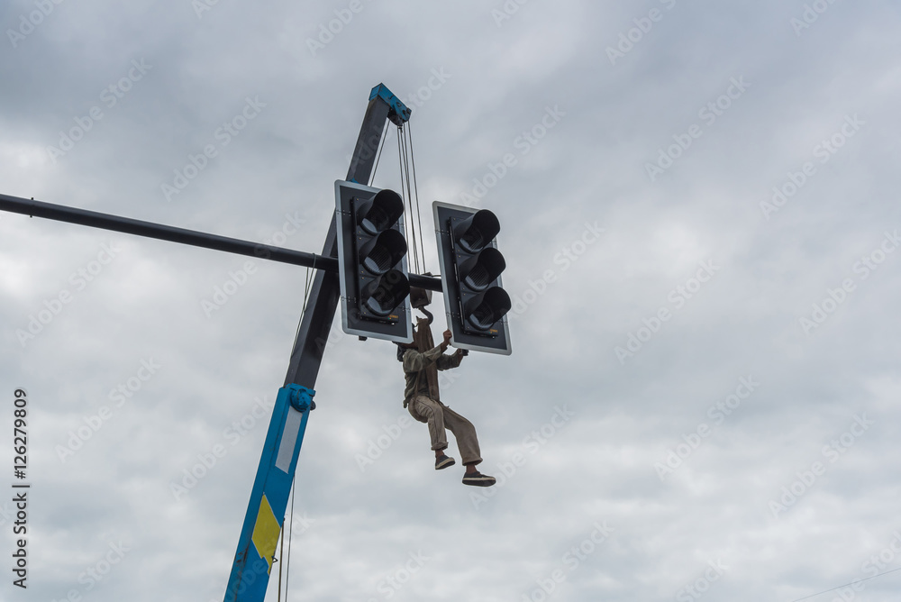 Electricians repair the traffic light,Repair of traffic lights Stock