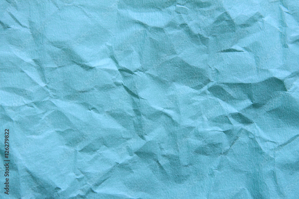 Fototapeta premium Background of blue empty wrinkled paper. Backdrop texture with c