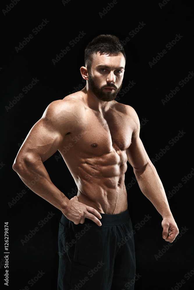 Fototapeta premium Muscular bodybuilder guy doing posing