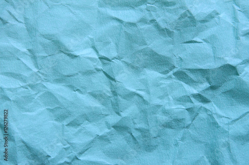 Background of blue empty wrinkled paper. Backdrop texture with c